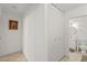 Hallway leading to a bathroom with a white vanity and mirror at 2963 Greendale St, Las Vegas, NV 89121