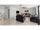 Bright living room featuring tiled floors, a ceiling fan, and elegant furnishings for a comfortable space at 2963 Greendale St, Las Vegas, NV 89121