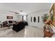 Inviting living room with tiled floors, ceiling fan, fireplace, and comfortable seating for relaxation at 2963 Greendale St, Las Vegas, NV 89121