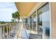 Condo balcony featuring seating area, outdoor rug and a view of the palms and city beyond at 3111 Bel Air Dr # 5F, Las Vegas, NV 89109