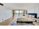 Bedroom with natural light and hardwood floors leads to a private outdoor balcony at 3111 Bel Air Dr # 5F, Las Vegas, NV 89109