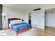Comfortable bedroom featuring wood floors, a plush rug, and access to an ensuite bathroom at 3111 Bel Air Dr # 5F, Las Vegas, NV 89109