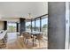 Bright dining room with balcony access offers stunning views and a modern chandelier at 3111 Bel Air Dr # 5F, Las Vegas, NV 89109