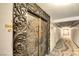 Ornate double entry doors and a hallway in a well maintained building at 3111 Bel Air Dr # 5F, Las Vegas, NV 89109
