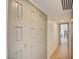 Hallway features custom-paneled doors, hardwood flooring, and recessed lighting at 3111 Bel Air Dr # 5F, Las Vegas, NV 89109