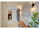 Inviting hallway with bench, decorative artwork, statement doors, and view of a half bathroom at 3111 Bel Air Dr # 5F, Las Vegas, NV 89109