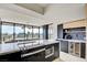 Open kitchen with breakfast bar, modern appliances, and adjacent dining area at 3111 Bel Air Dr # 5F, Las Vegas, NV 89109