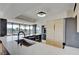 Open kitchen with marble island, stainless steel appliances, and adjacent dining area at 3111 Bel Air Dr # 5F, Las Vegas, NV 89109