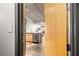 Apartment entry way with neutral color palette with a partial view of the kitchen at 353 E Bonneville Ave # 311, Las Vegas, NV 89101