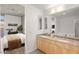Bright bathroom features a double vanity with granite countertops and a large mirror at 353 E Bonneville Ave # 311, Las Vegas, NV 89101