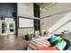 Relaxing common area features a large screen and comfortable seating with colorful pillows and striped patterns at 353 E Bonneville Ave # 311, Las Vegas, NV 89101