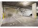Parking garage with designated parking spots and visible pipes overhead, offering convenient and secure parking at 353 E Bonneville Ave # 311, Las Vegas, NV 89101
