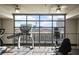 Well-equipped gym overlooking city skyline, with treadmills and exercise bikes at 353 E Bonneville Ave # 311, Las Vegas, NV 89101