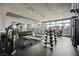 Spacious gym with various weight machines, free weights, and city views at 353 E Bonneville Ave # 311, Las Vegas, NV 89101