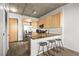 Stylish kitchen featuring wooden cabinets, granite countertops, and stainless steel appliances, blending form and function at 353 E Bonneville Ave # 311, Las Vegas, NV 89101