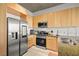 Modern kitchen with stainless steel appliances and light wood cabinets provides a delightful culinary experience at 353 E Bonneville Ave # 311, Las Vegas, NV 89101