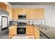 Modern kitchen with stainless steel appliances, granite countertops, and light wood cabinetry at 353 E Bonneville Ave # 311, Las Vegas, NV 89101