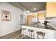 Elegant kitchen with wooden cabinets, granite countertops, and bar stool seating blending style and functionality at 353 E Bonneville Ave # 311, Las Vegas, NV 89101