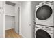 Convenient laundry room featuring a stacked washer and dryer at 353 E Bonneville Ave # 311, Las Vegas, NV 89101