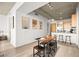 A dining table connects the living space with the kitchen, creating an inviting and functional area for entertaining at 353 E Bonneville Ave # 311, Las Vegas, NV 89101
