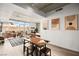 Open floor plan featuring a dining table that connects a living space with outside views for a bright and airy ambiance at 353 E Bonneville Ave # 311, Las Vegas, NV 89101