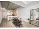 Bright living area with modern kitchen, dining table, and stylish décor with concrete ceilings at 353 E Bonneville Ave # 311, Las Vegas, NV 89101