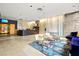 Modern lobby area with stylish seating, wood reception desk, and vibrant area rug at 353 E Bonneville Ave # 311, Las Vegas, NV 89101