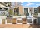 Outdoor kitchen area with stainless steel grills and built-in cabinetry at 353 E Bonneville Ave # 311, Las Vegas, NV 89101