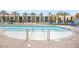 Inviting swimming pool with lounge chairs and palm trees at 353 E Bonneville Ave # 311, Las Vegas, NV 89101