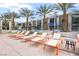 Pool deck area with chaise lounges and palm tree landscaping at 353 E Bonneville Ave # 311, Las Vegas, NV 89101