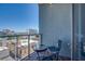 Balcony offers city views with seating area with tables and chairs at 353 E Bonneville Ave # 905, Las Vegas, NV 89101