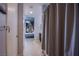 View of the bathroom leading into bedroom with custom closet, showcasing the suite's thoughtful design at 353 E Bonneville Ave # 905, Las Vegas, NV 89101