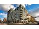 Modern high-rise building with floor-to-ceiling windows, balconies, and a view of the surrounding city at 353 E Bonneville Ave # 905, Las Vegas, NV 89101