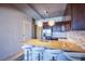Stylish kitchen with bar seating and stainless steel appliances and wine storage at 353 E Bonneville Ave # 905, Las Vegas, NV 89101