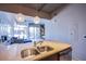 A modern kitchen with granite counters flows to the living room in this contemporary design at 353 E Bonneville Ave # 905, Las Vegas, NV 89101