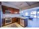 Bright kitchen with stainless steel appliances and views to living area and balcony at 353 E Bonneville Ave # 905, Las Vegas, NV 89101
