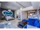 Open-concept space seamlessly blends living, dining, and kitchen areas, with a vibrant heart accent wall at 353 E Bonneville Ave # 905, Las Vegas, NV 89101