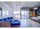 Open floor plan with a large sofa, bedroom, balcony, and expansive city views at 353 E Bonneville Ave # 905, Las Vegas, NV 89101