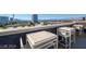 A rooftop deck with seating that showcases a panoramic view of the city skyline at 353 E Bonneville Ave # 905, Las Vegas, NV 89101