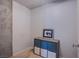 Neutral room showing wood floors, small storage unit, and art on the wall at 353 E Bonneville Ave # 905, Las Vegas, NV 89101