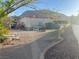 Spacious backyard with desert landscaping and mountain views, providing a serene outdoor retreat at 441 Daylin Ct, Henderson, NV 89015
