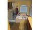 Bright bathroom with a glass shower, tub, and neutral-toned vanity, offering a relaxing space at 4650 Ranch House Rd # 64, North Las Vegas, NV 89031