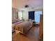 Inviting bedroom featuring wood flooring, soft curtains, and a soothing color palette for peaceful rest at 4650 Ranch House Rd # 64, North Las Vegas, NV 89031