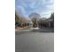 Gated community entrance with mature trees and well-maintained landscaping at 4650 Ranch House Rd # 64, North Las Vegas, NV 89031