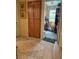 Hallway features ample storage with floor-to-ceiling cabinets and doorway to laundry room at 4650 Ranch House Rd # 64, North Las Vegas, NV 89031
