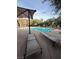 Resort style community pool with lounge chairs and umbrellas for relaxation and recreation at 4650 Ranch House Rd # 64, North Las Vegas, NV 89031