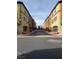 Street view showcasing colorful townhomes with manicured landscaping and inviting curb appeal at 4650 Ranch House Rd # 64, North Las Vegas, NV 89031