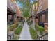 Beautiful walkway between townhomes with lush landscaping and inviting entrances at 4650 Ranch House Rd # 64, North Las Vegas, NV 89031