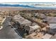 Scenic aerial view of homes with well-manicured yards nestled in a mountain and desert community at 479 Apogee, Mesquite, NV 89027