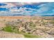 Aerial view of community and golf course nestled in Nevada mountains at 479 Apogee, Mesquite, NV 89027